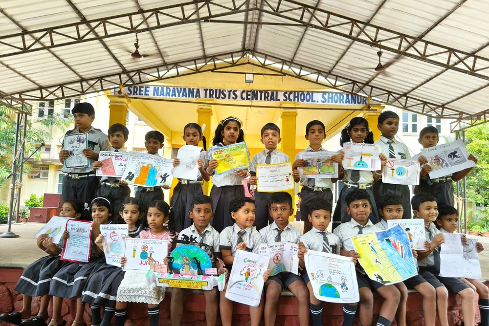 Students displaying their artwork